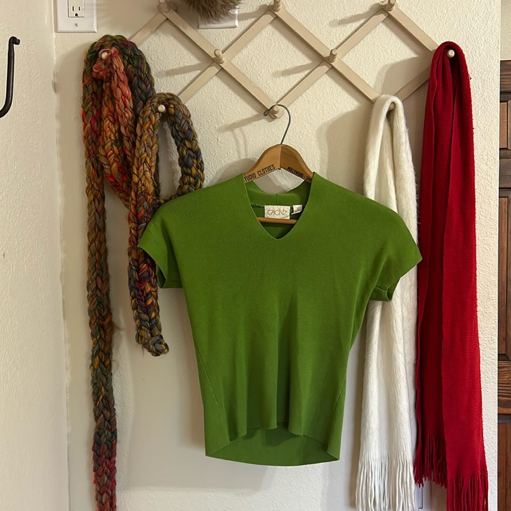 A green light weight short sleeve sweater